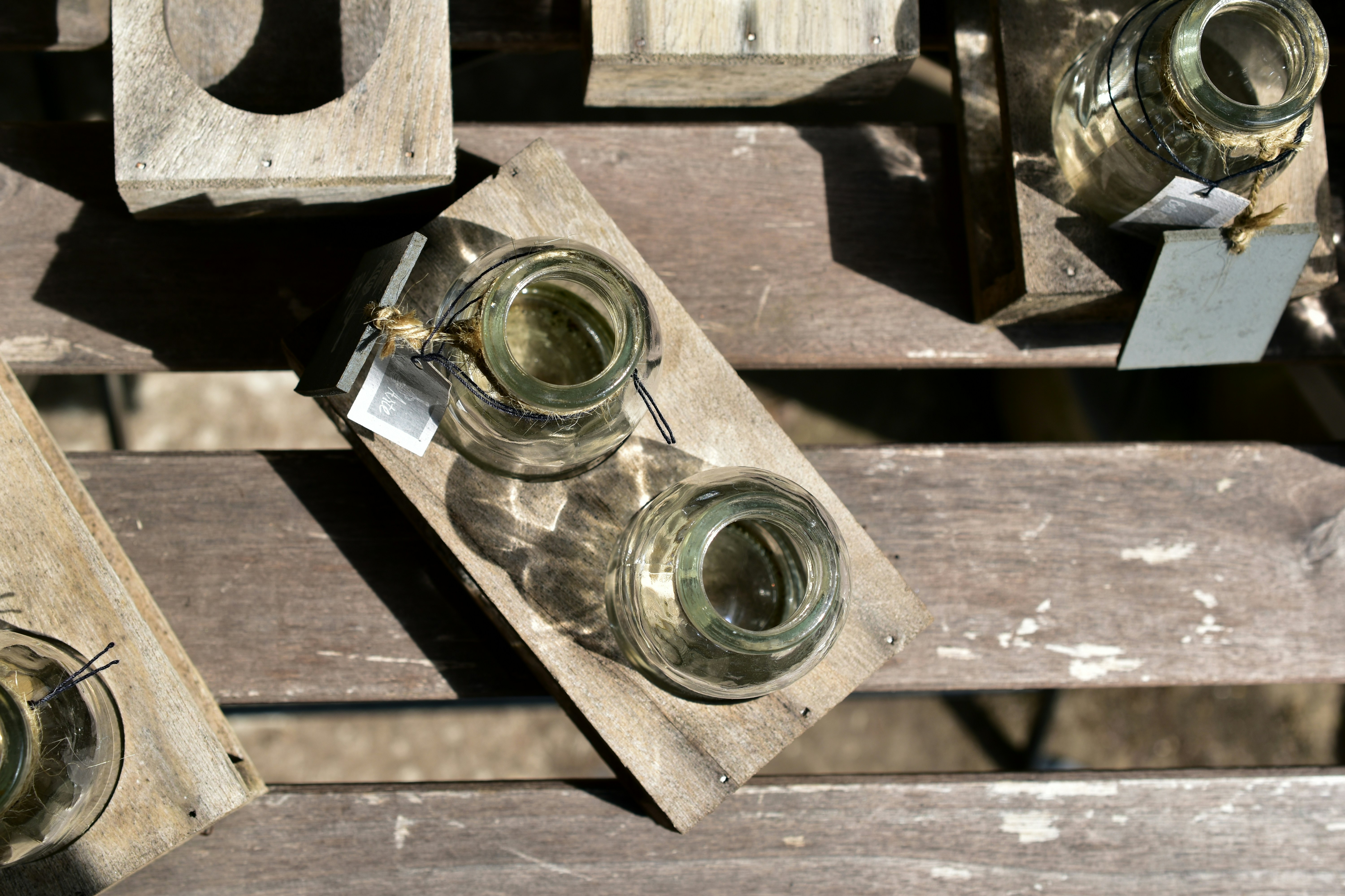 a couple of jars sitting on top of a wooden table