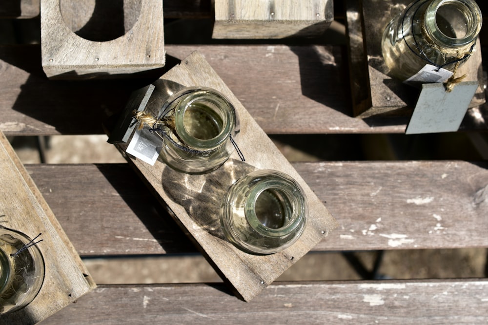 a couple of jars sitting on top of a wooden table