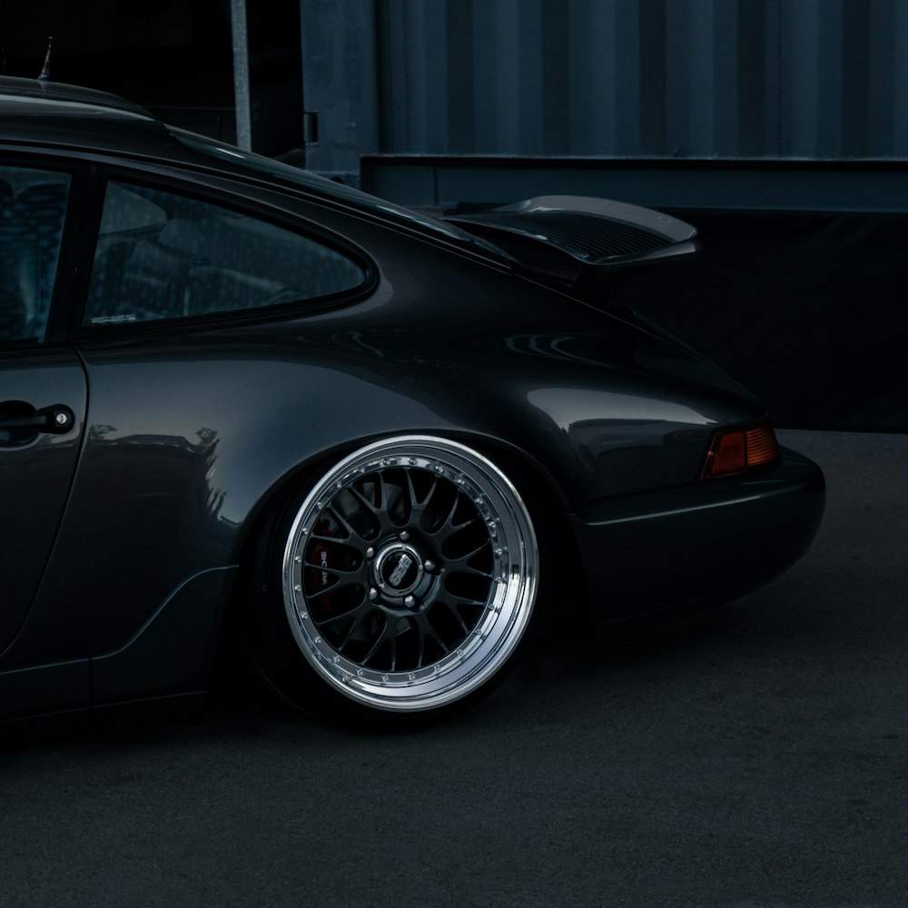 a black car parked in front of a building