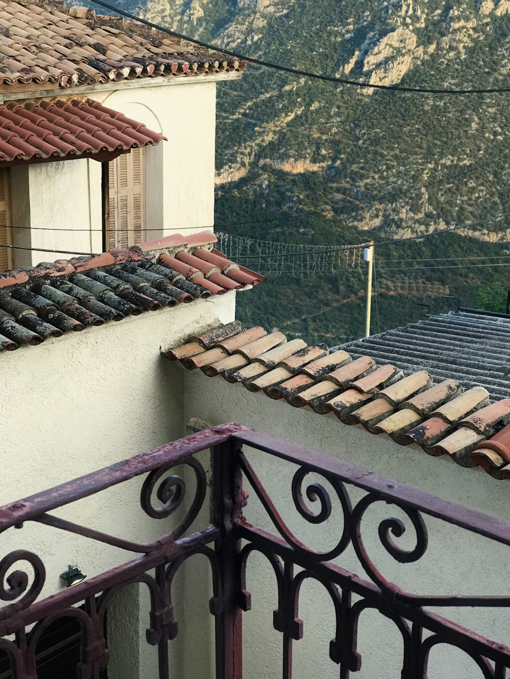 a balcony with a view of a mountain range