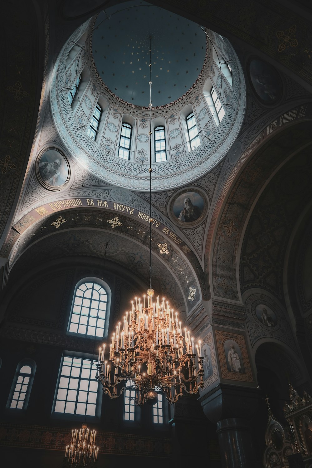 a chandelier hanging from the ceiling of a church