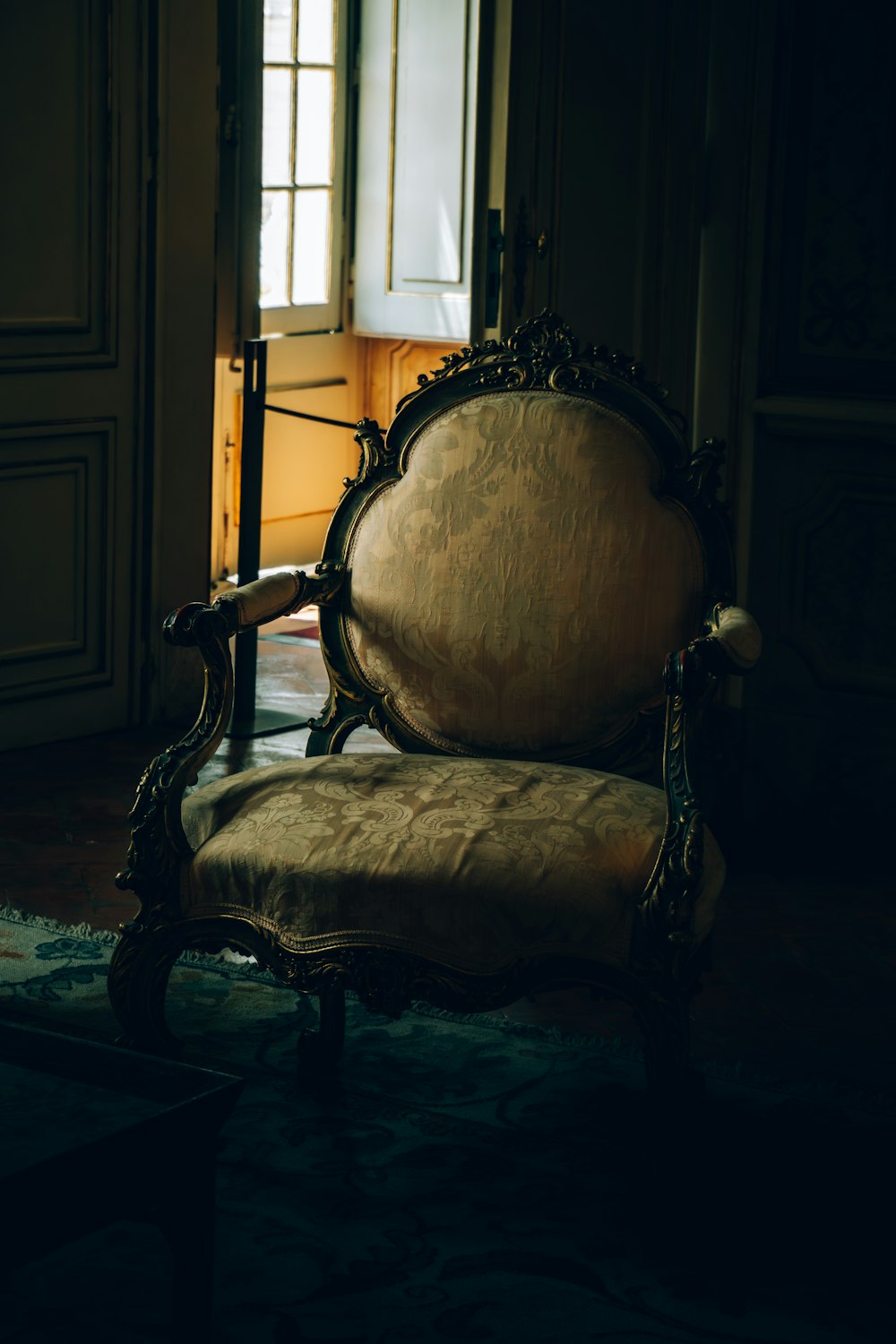 a chair sitting in front of a window in a room