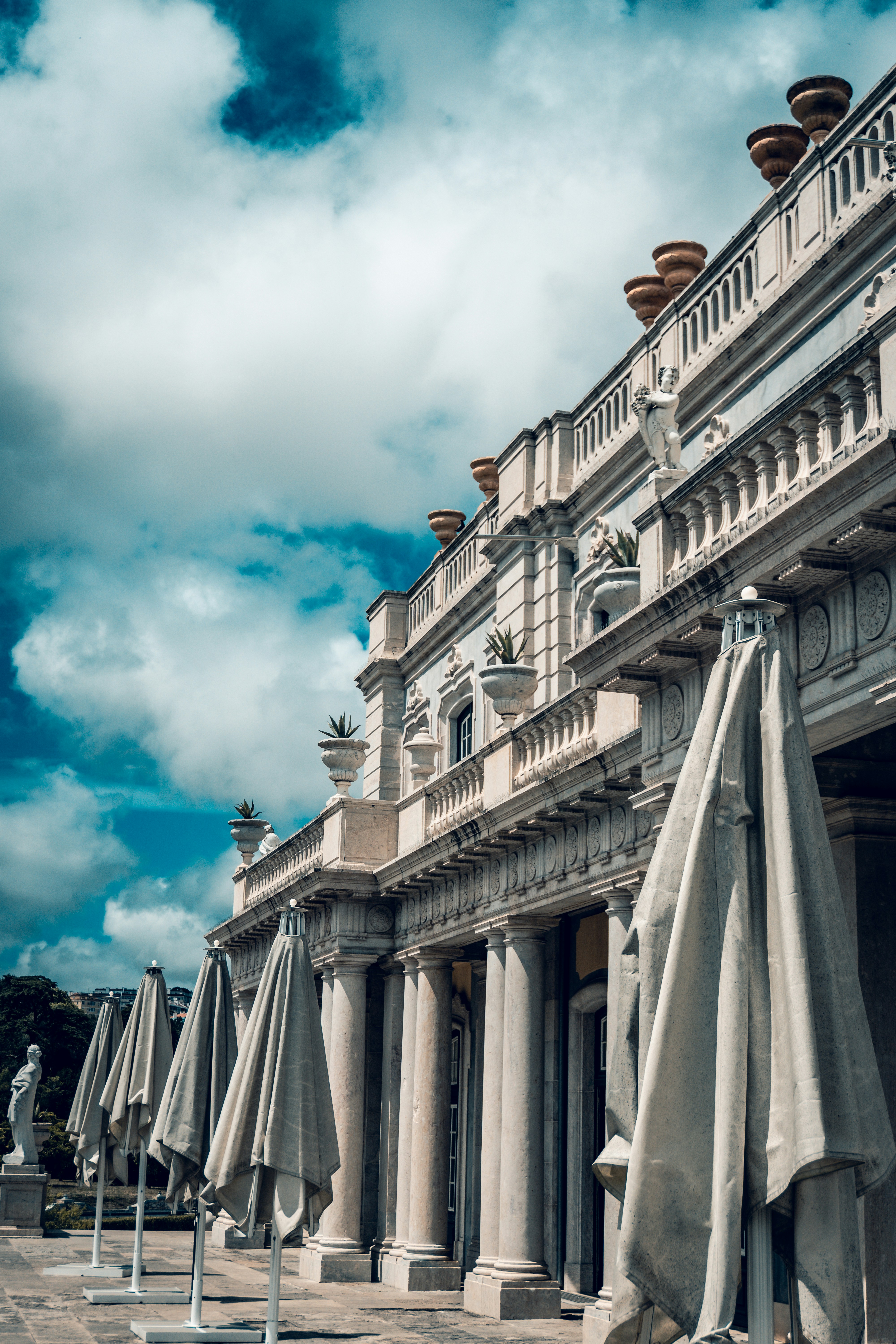 a row of umbrellas sitting outside of a building