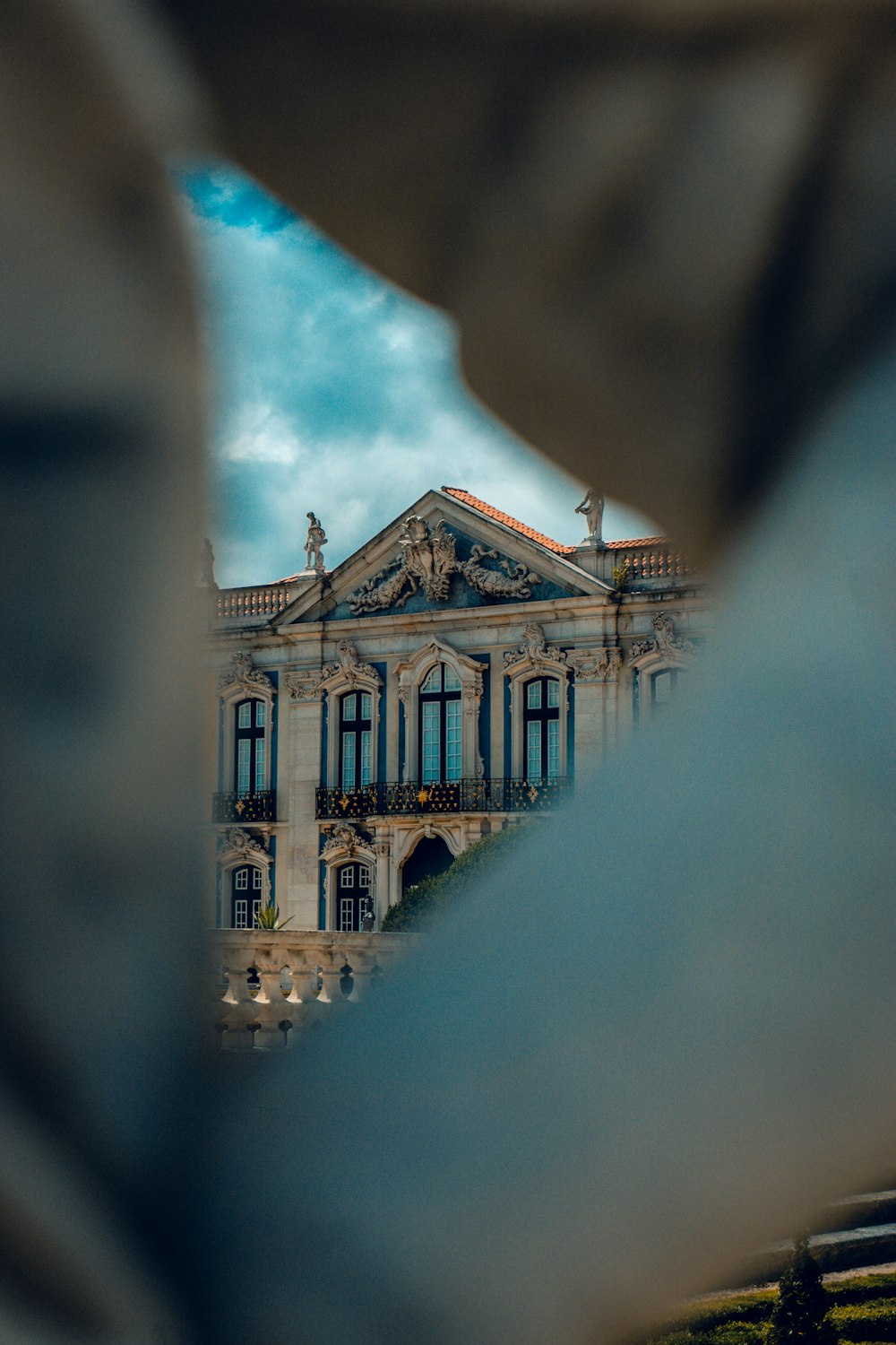 a view of a building through a fence