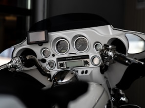 Clean, minimalist image of the motorcycle’s control panel and handlebar assembly.