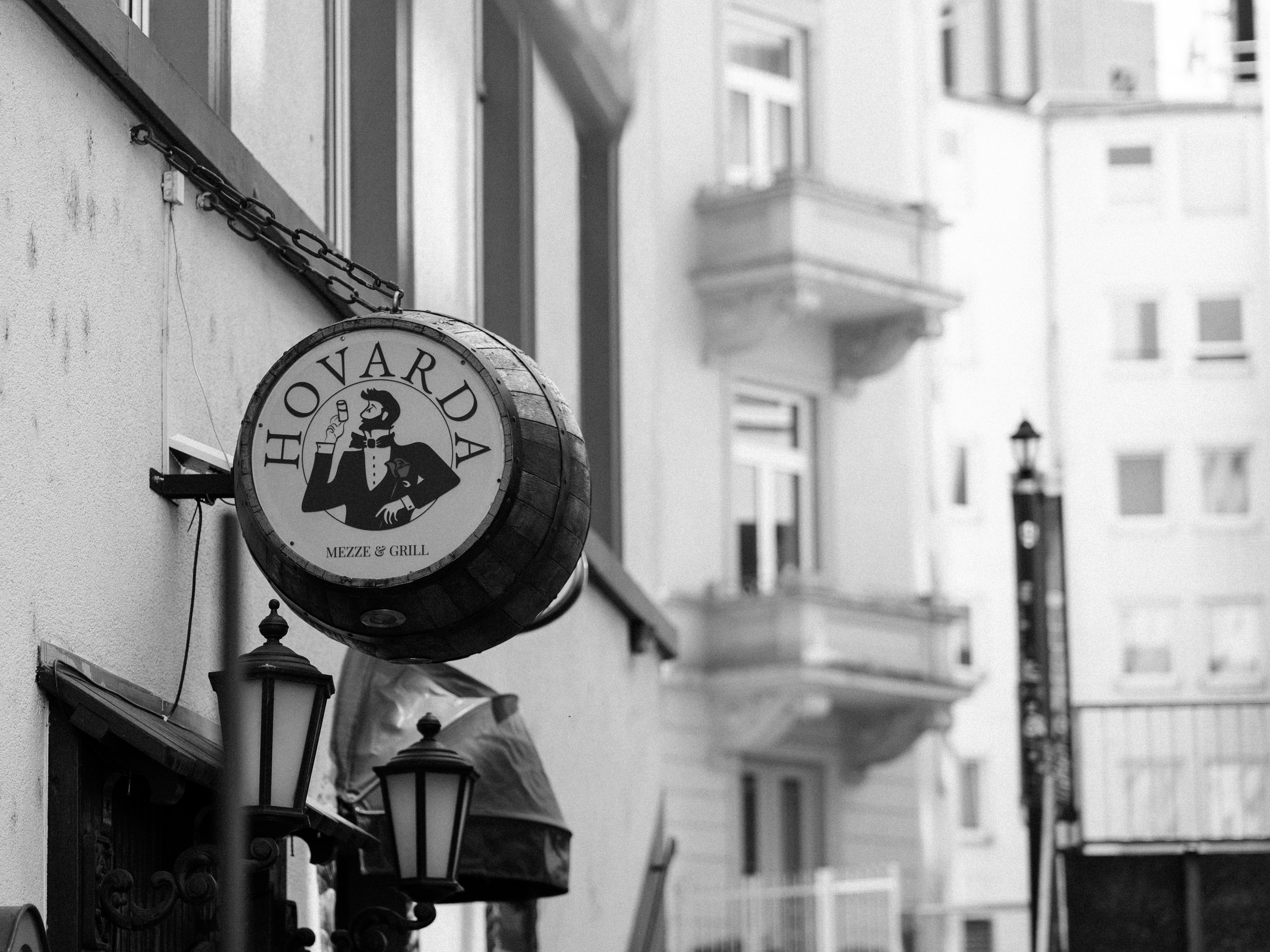 a black and white photo of a sign for a bar