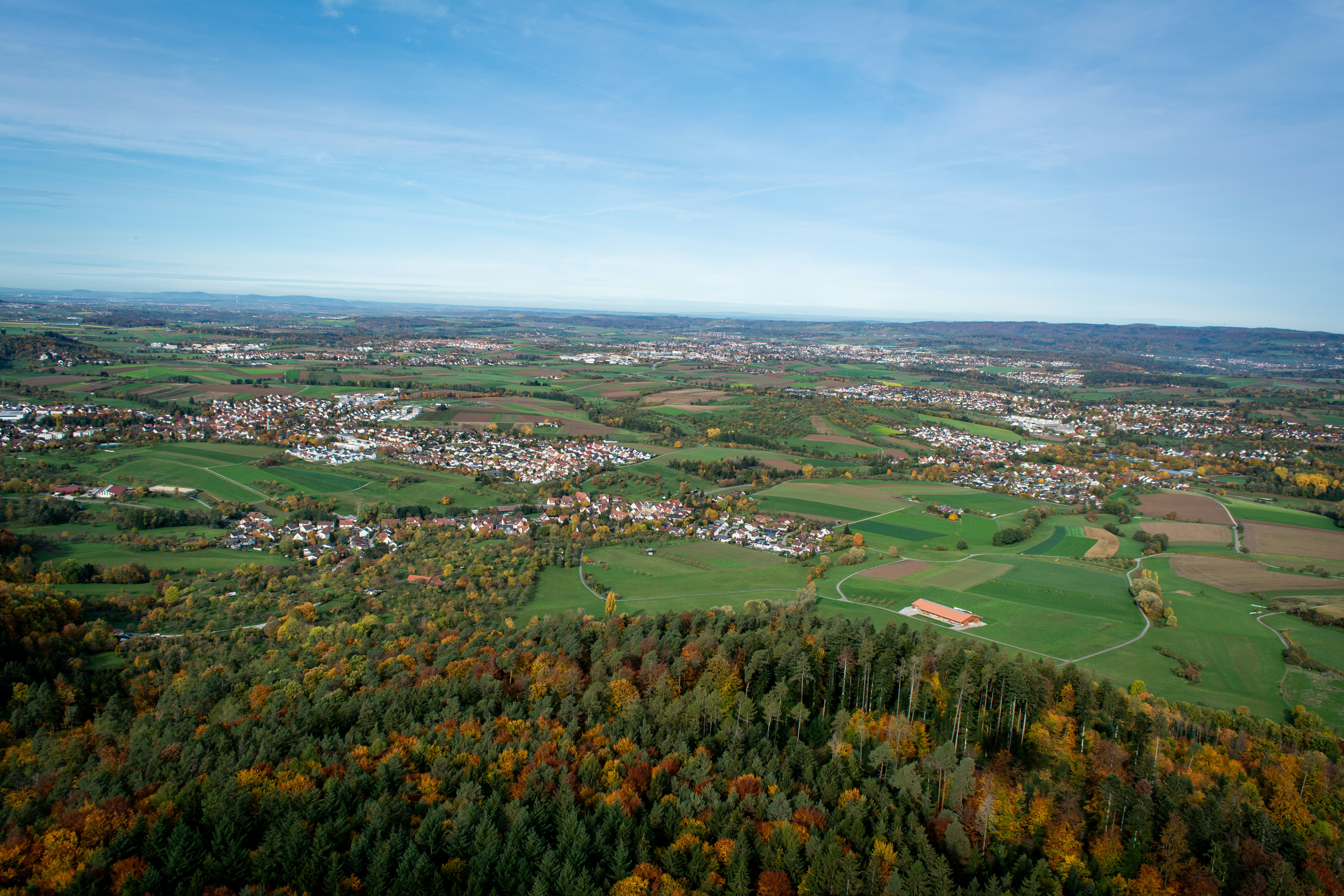 an aerial view of a city surrounded by trees