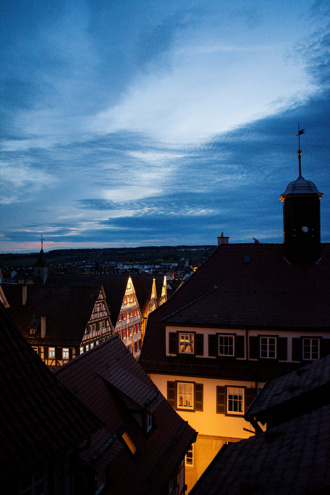 a view of a city at night from a rooftop