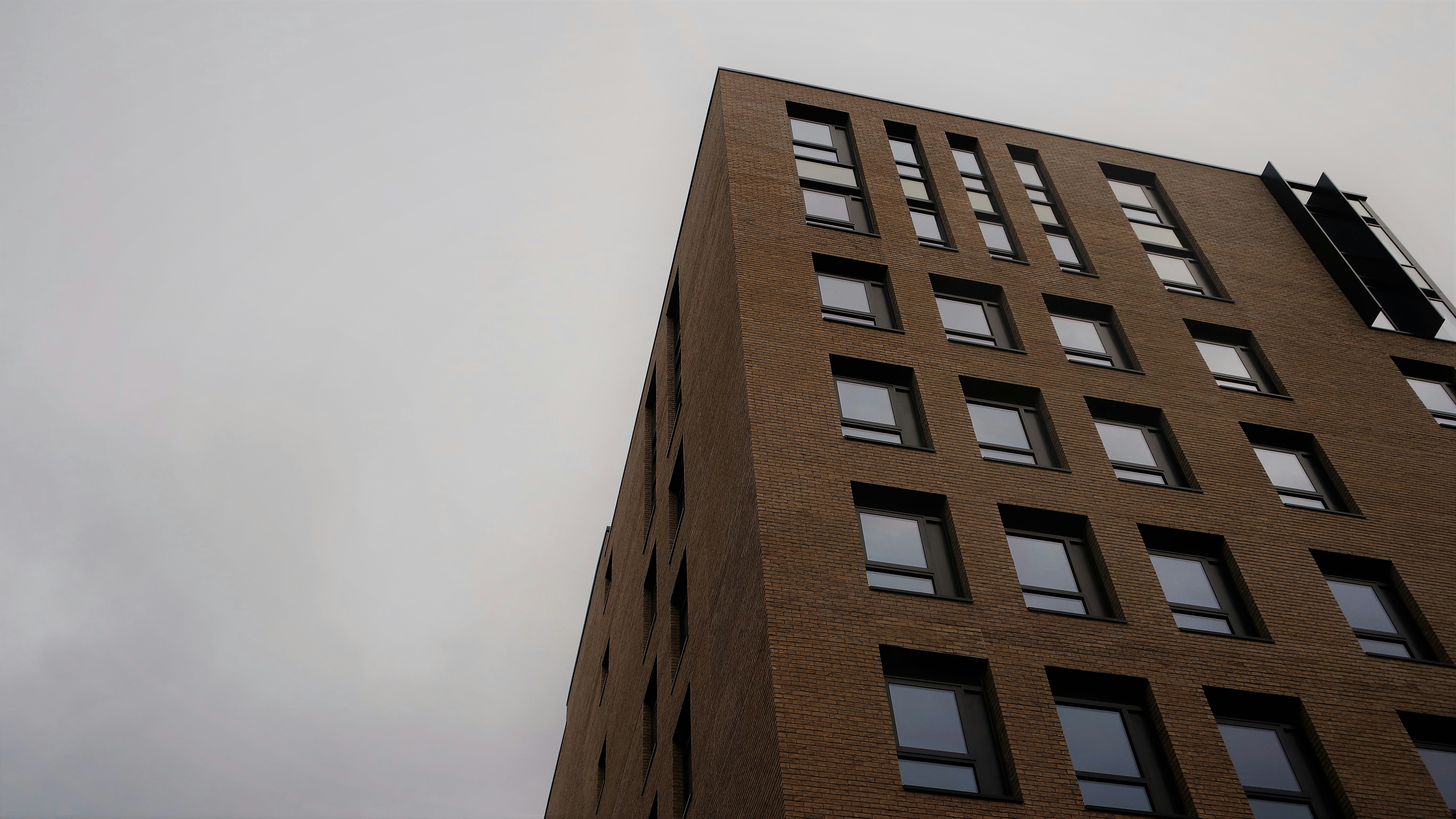 a tall brick building with lots of windows