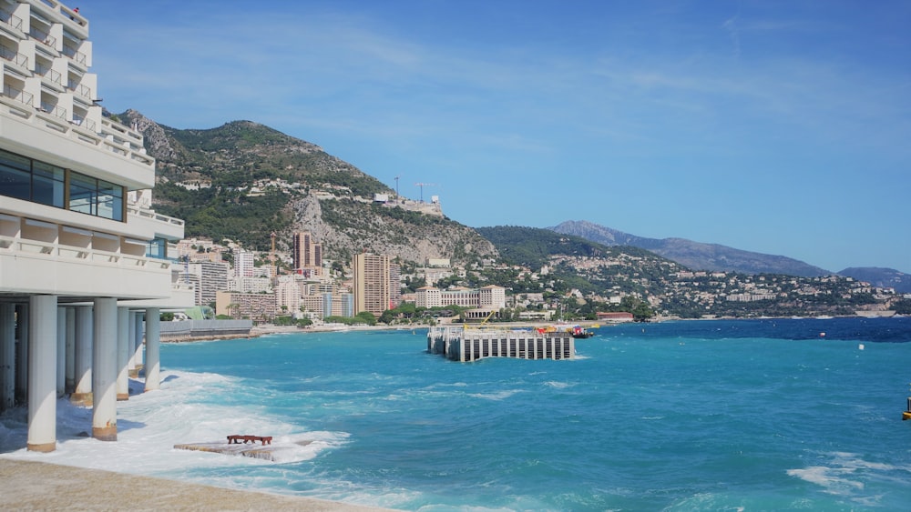 a view of a beach with a city in the background