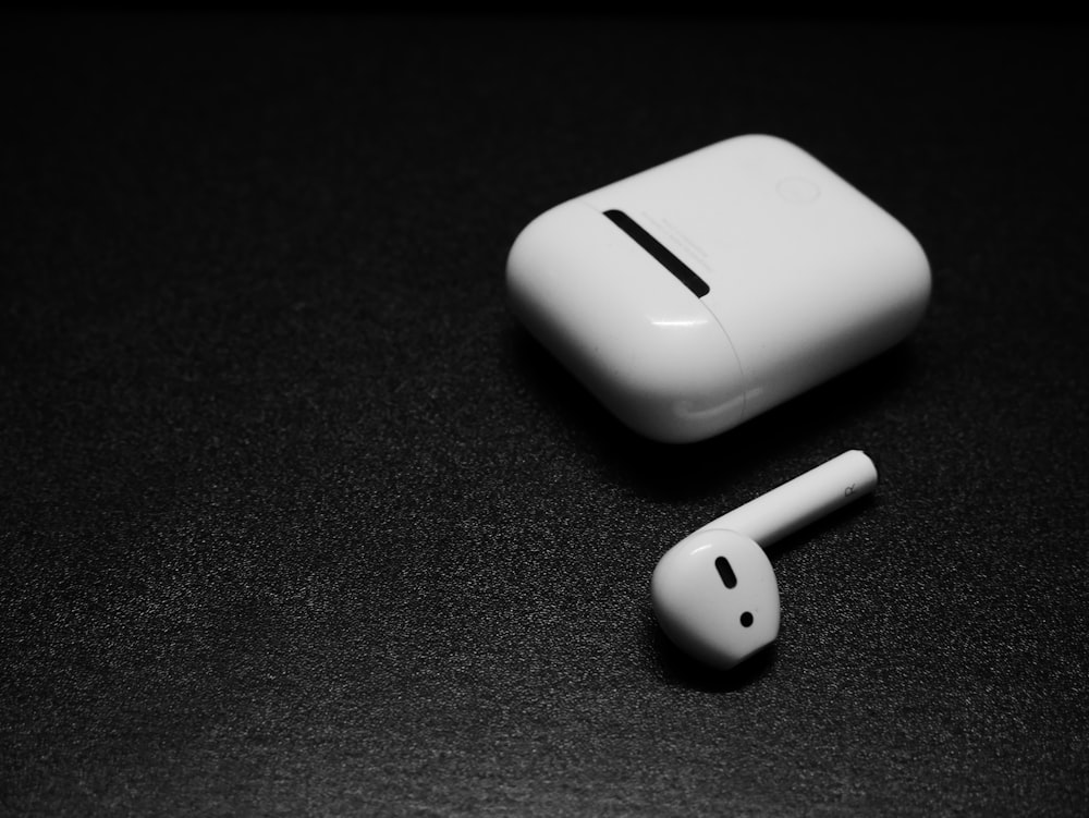 a pair of ear buds sitting on top of a table