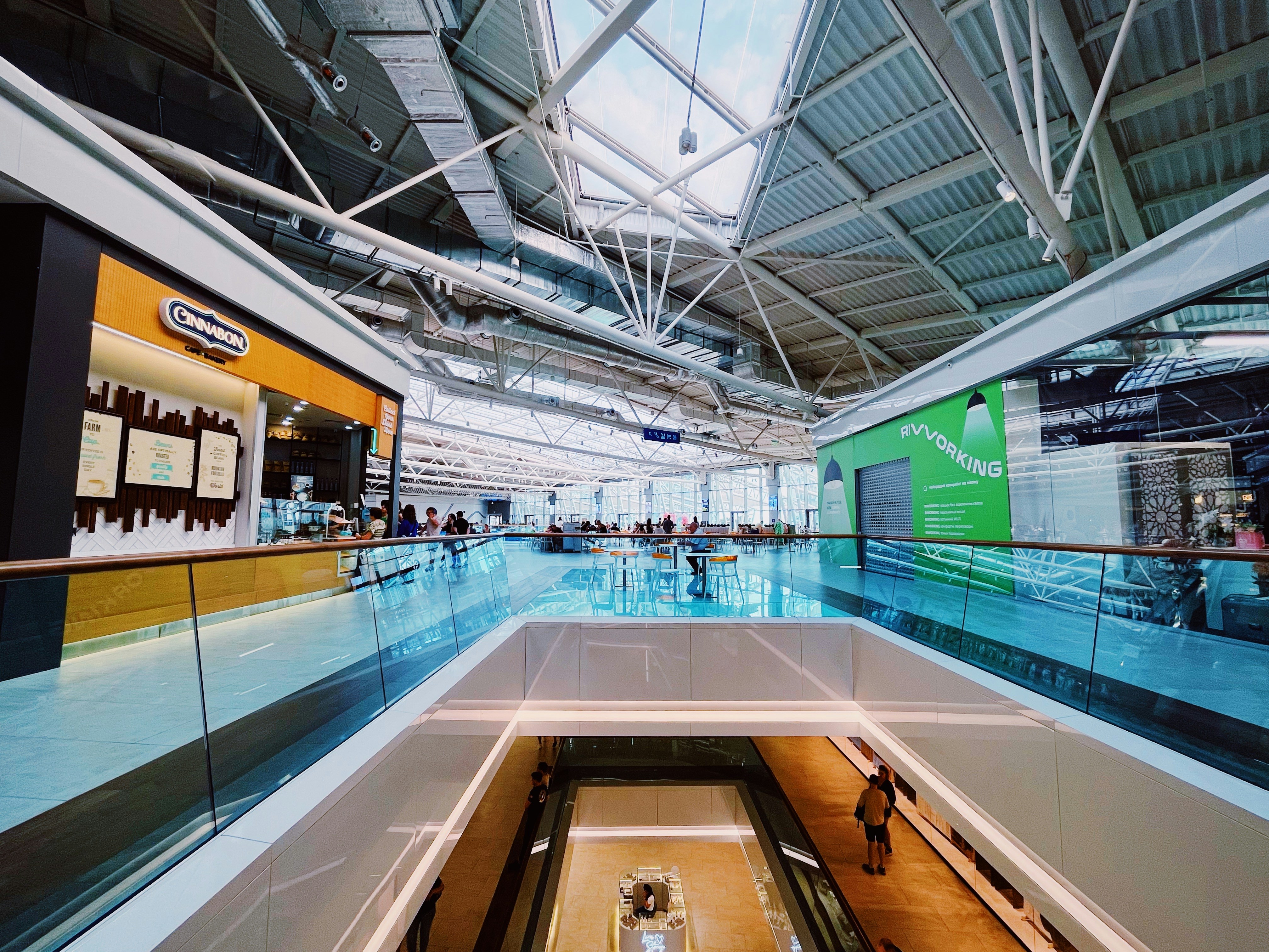 an empty mall with people walking around
