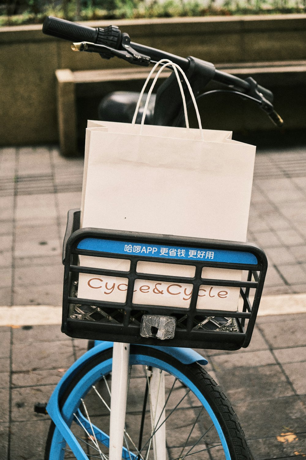 a bicycle with a bag on the back of it