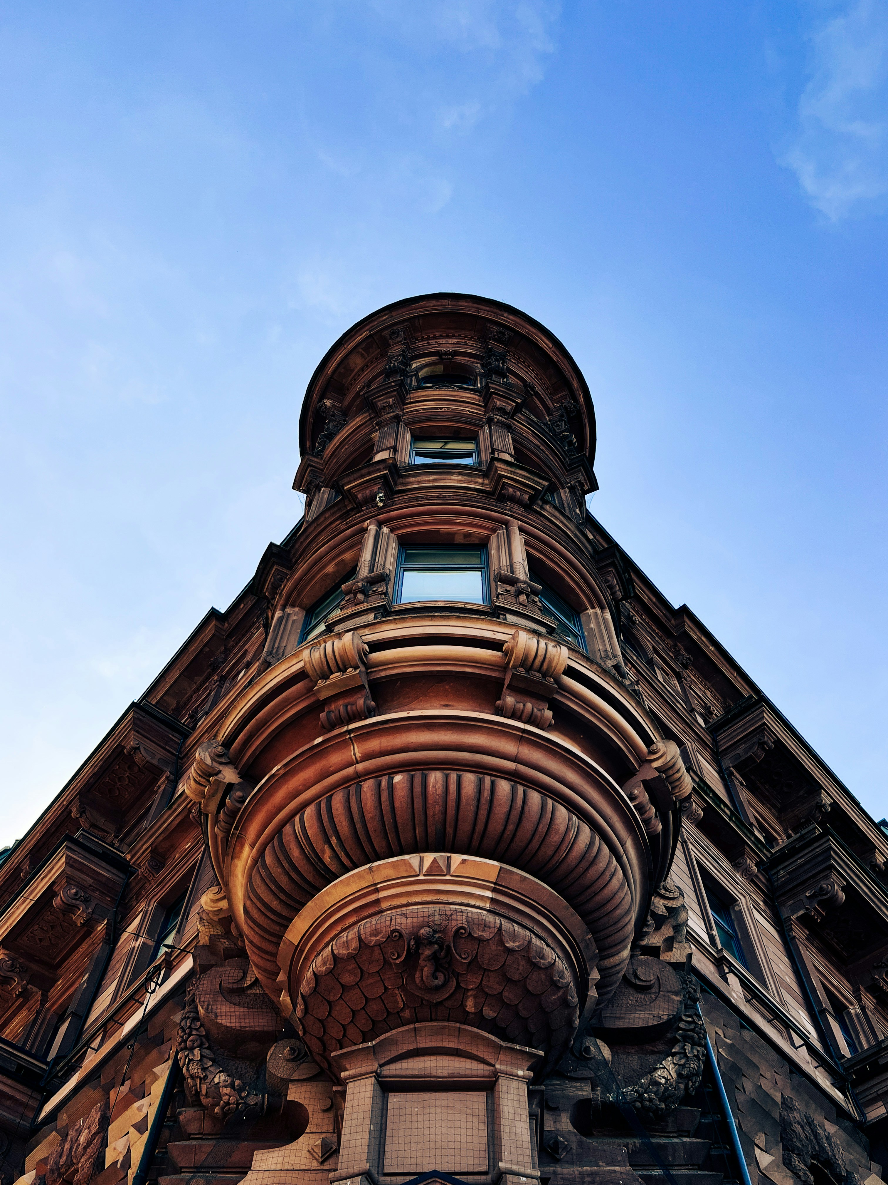 a tall building with a sky background
