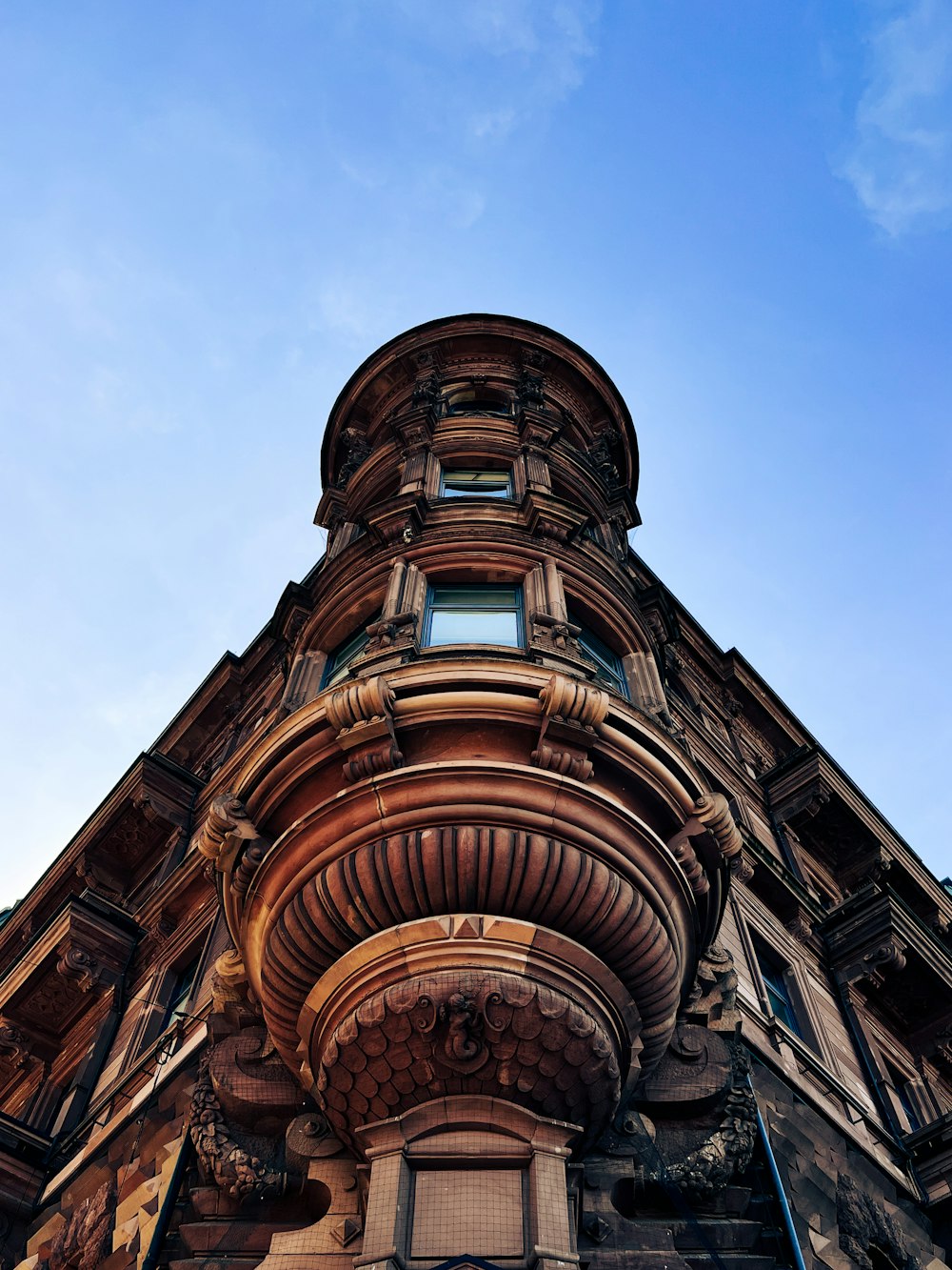 a tall building with a sky background