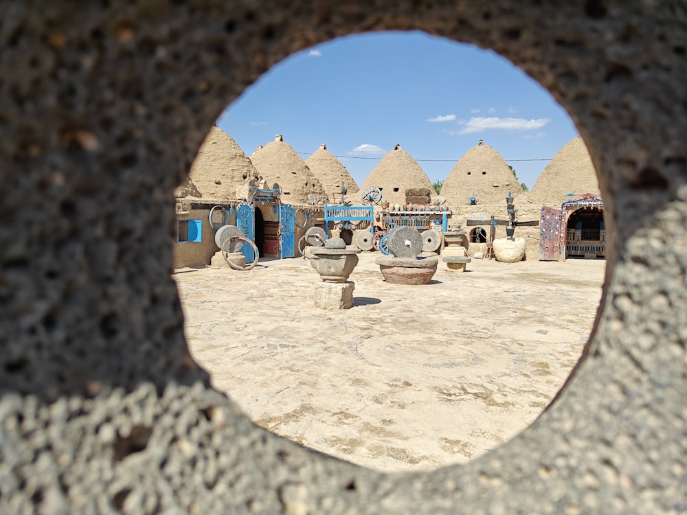 a view through a hole in a stone wall