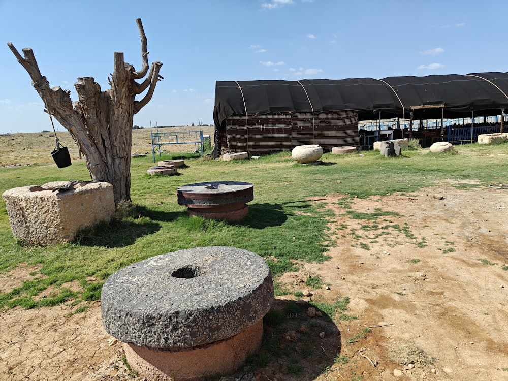 a large stone structure sitting in the middle of a field