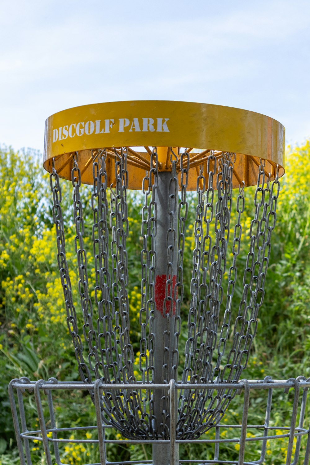 a metal basket with chains attached to it