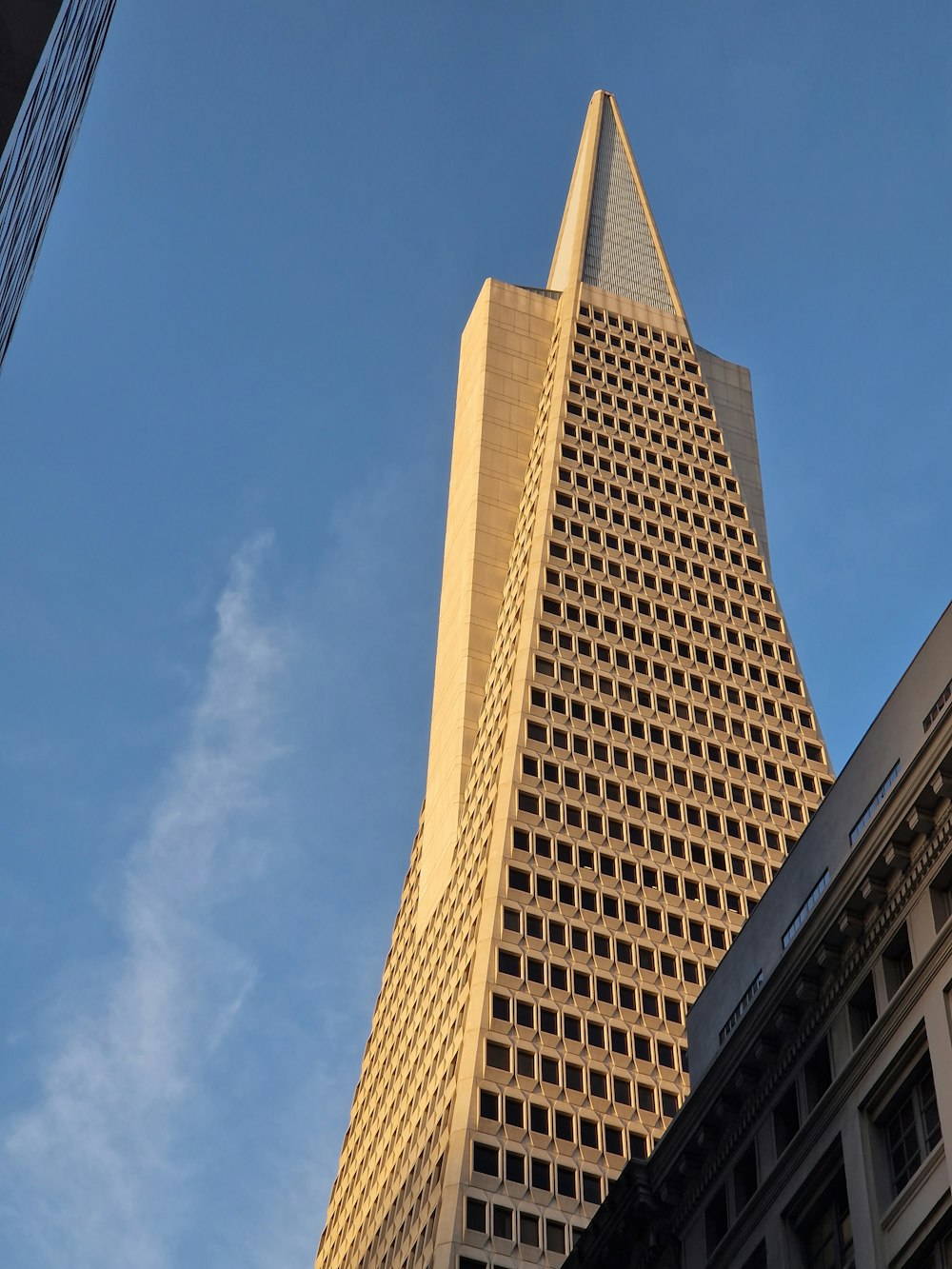 a very tall building with a sky background