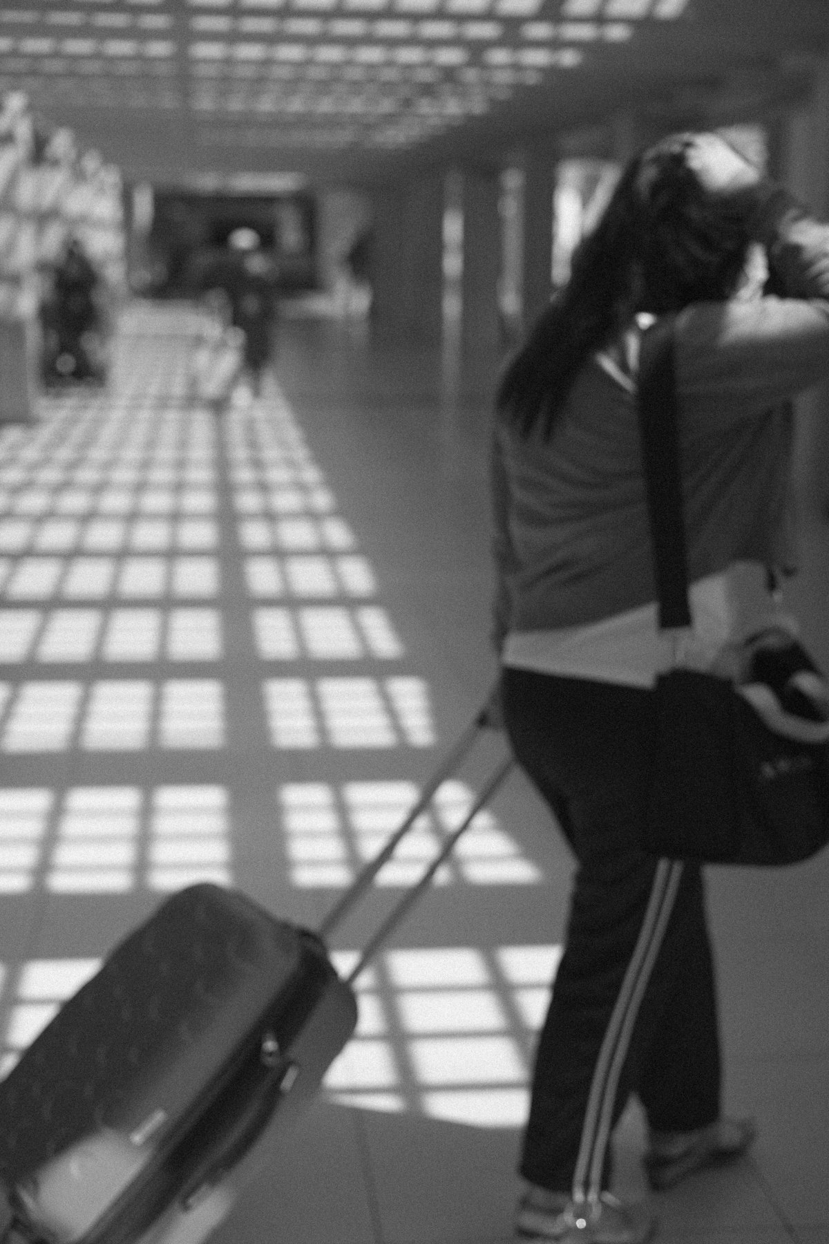 Pregnant traveler resting in hotel room with travel documents