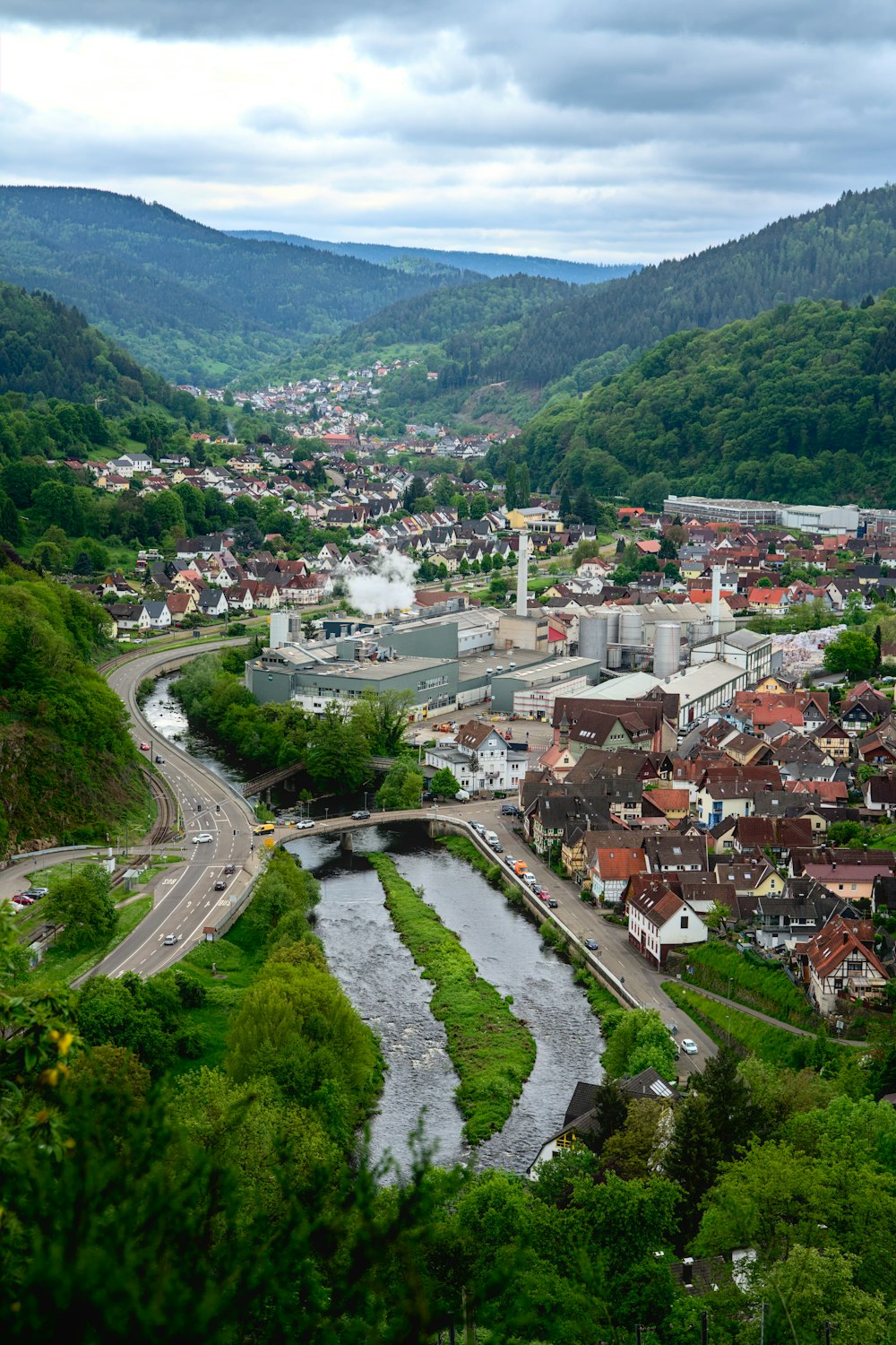 a river running through a lush green valley