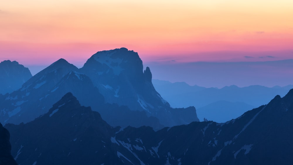 a view of a mountain range at sunset