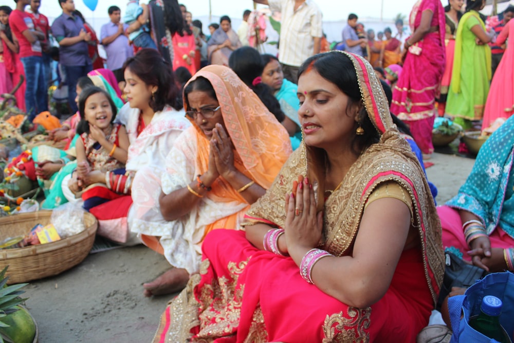 a group of women sitting next to each other