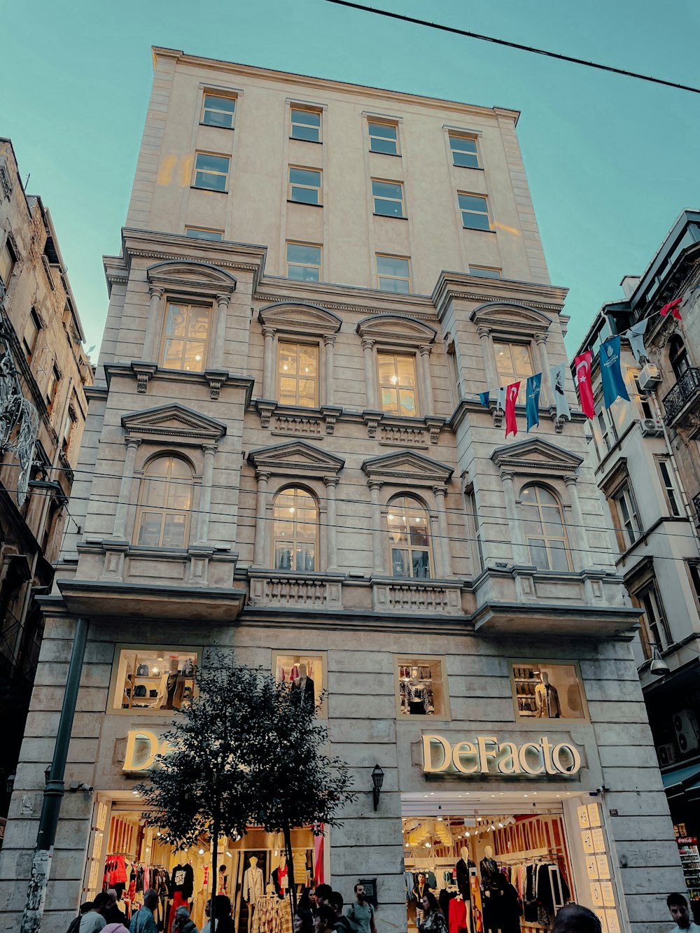 a group of people standing in front of a building