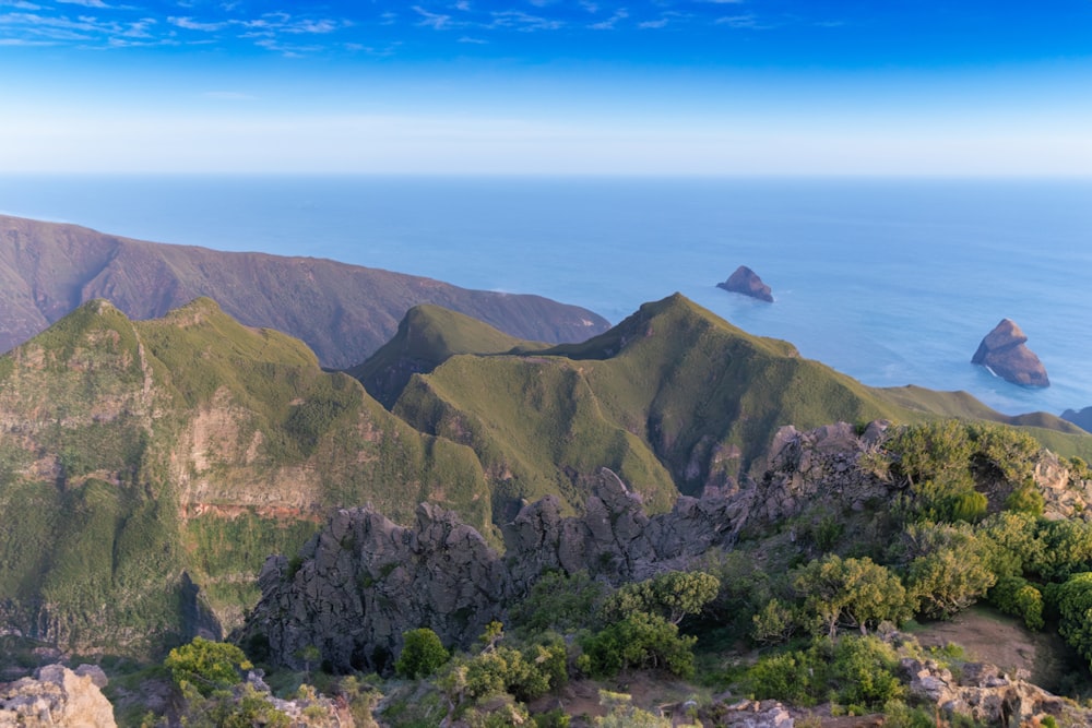 a view of a mountain range with a body of water in the background