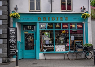 a bike is parked outside of a store