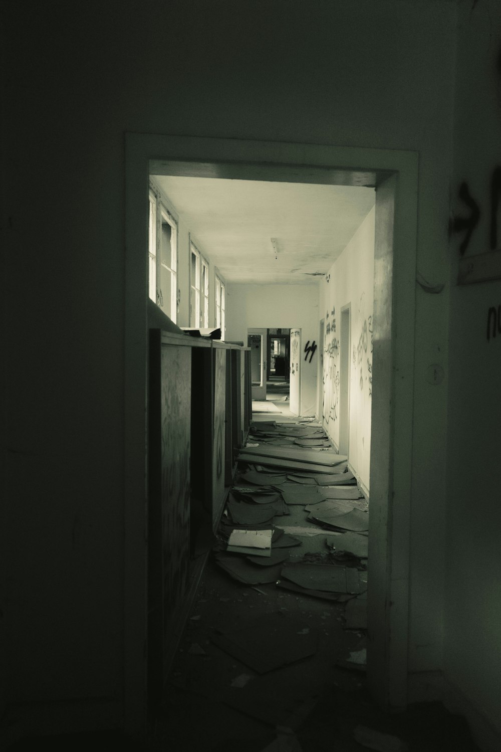 a long hallway with a bunch of books on the floor