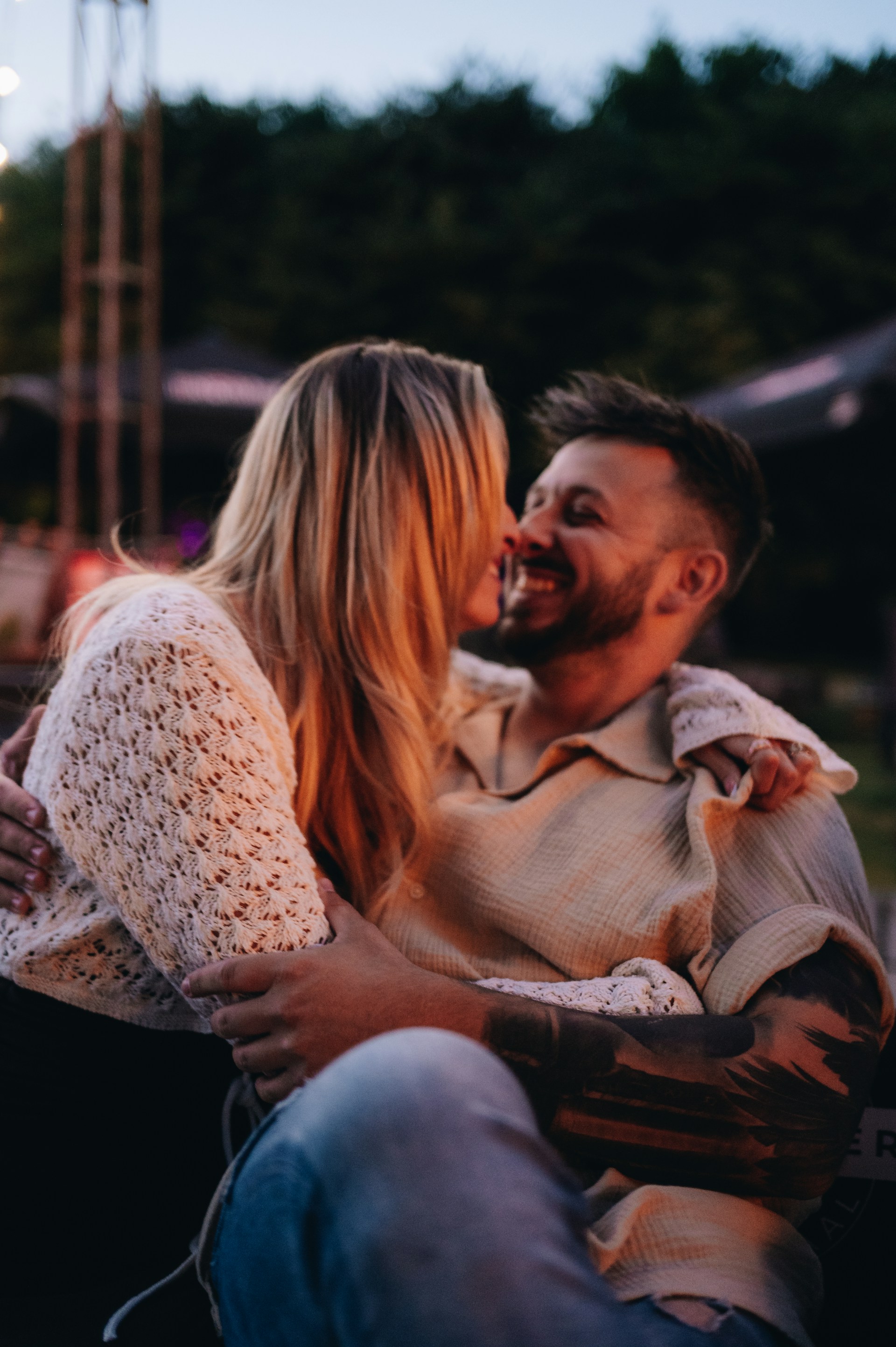 a man and a woman sitting on a bench