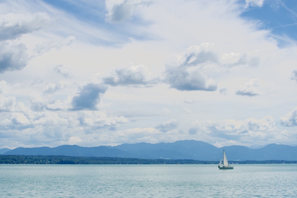 a sailboat in the middle of a large body of water