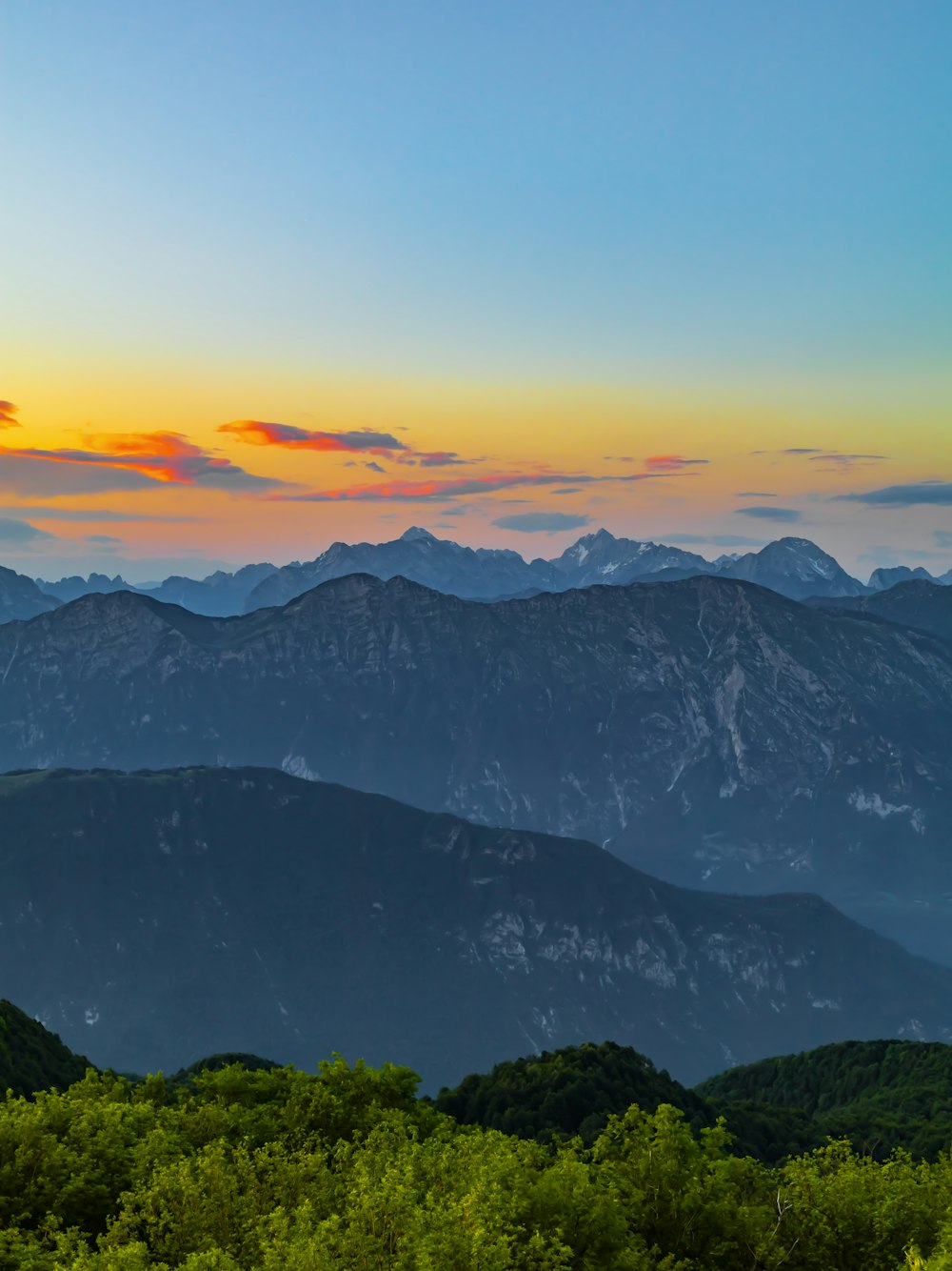 a view of a mountain range at sunset