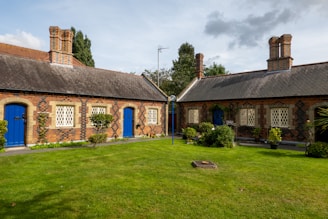 a brick building with blue doors and windows