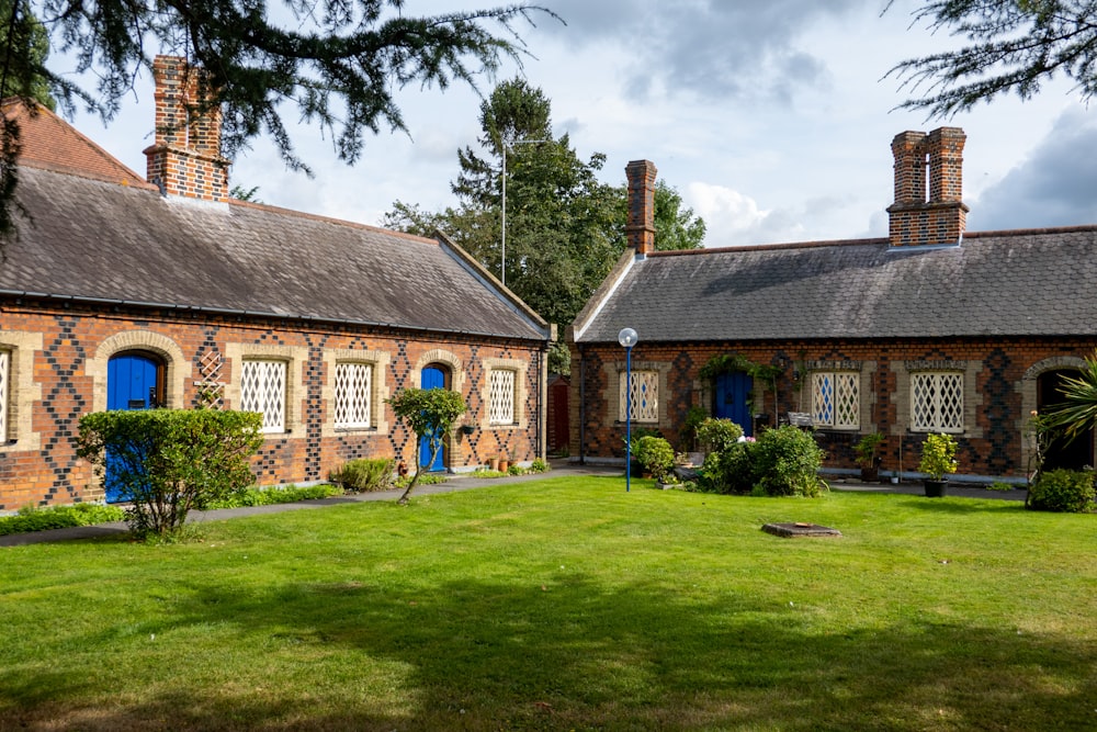 a brick building with blue doors and windows