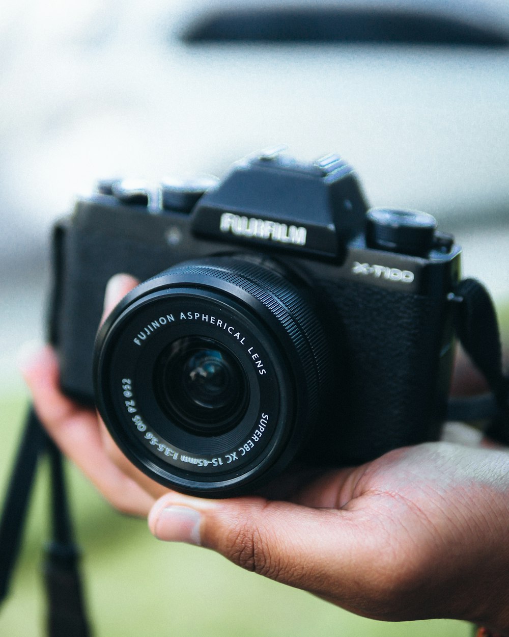 a person holding a camera in their hand