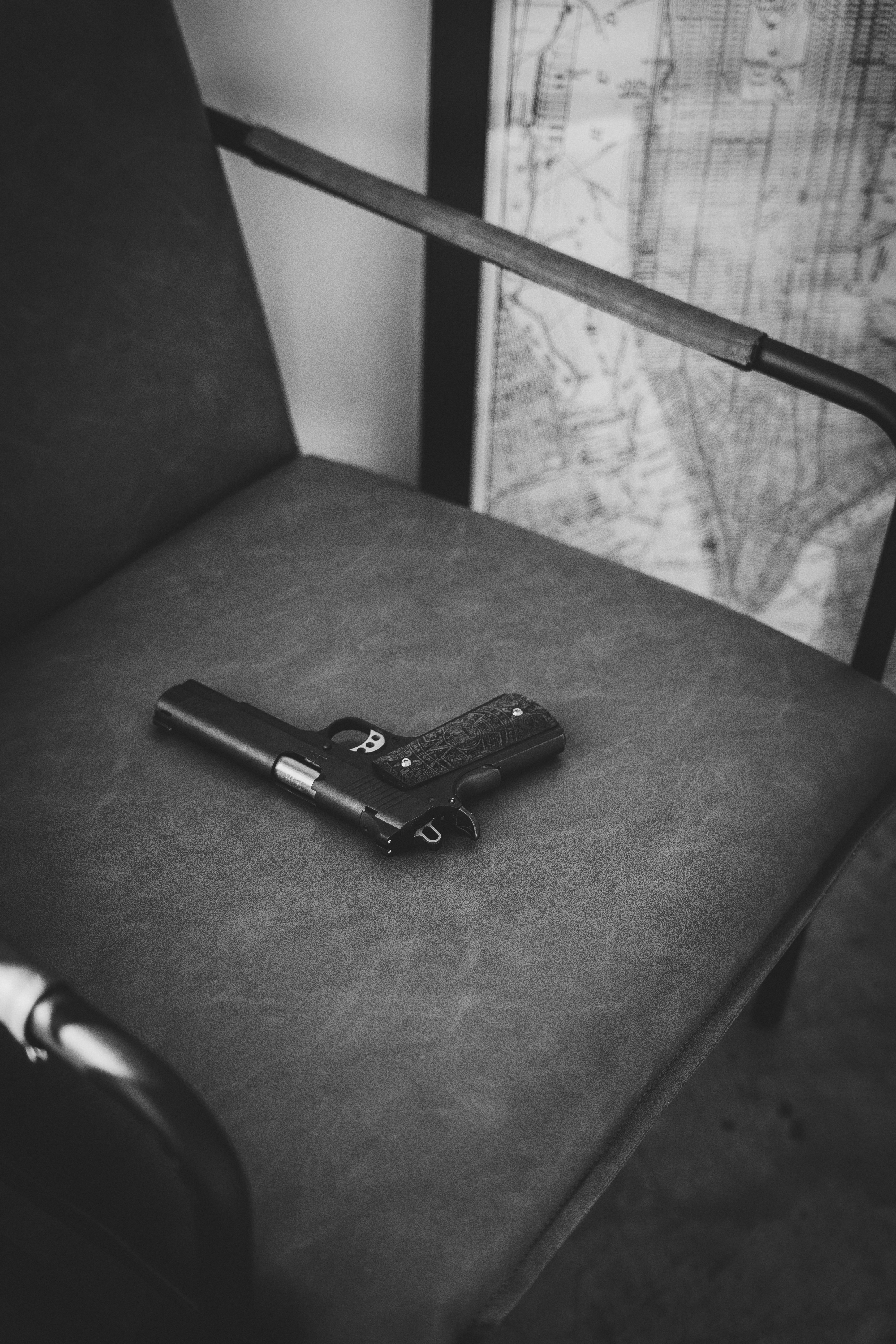 a cell phone sitting on top of a leather chair