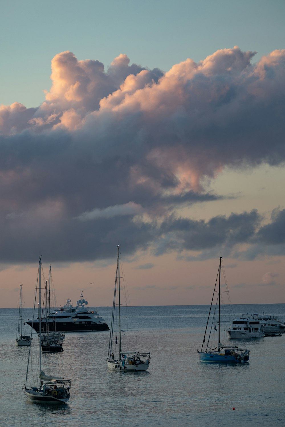 a group of boats floating on top of a body of water