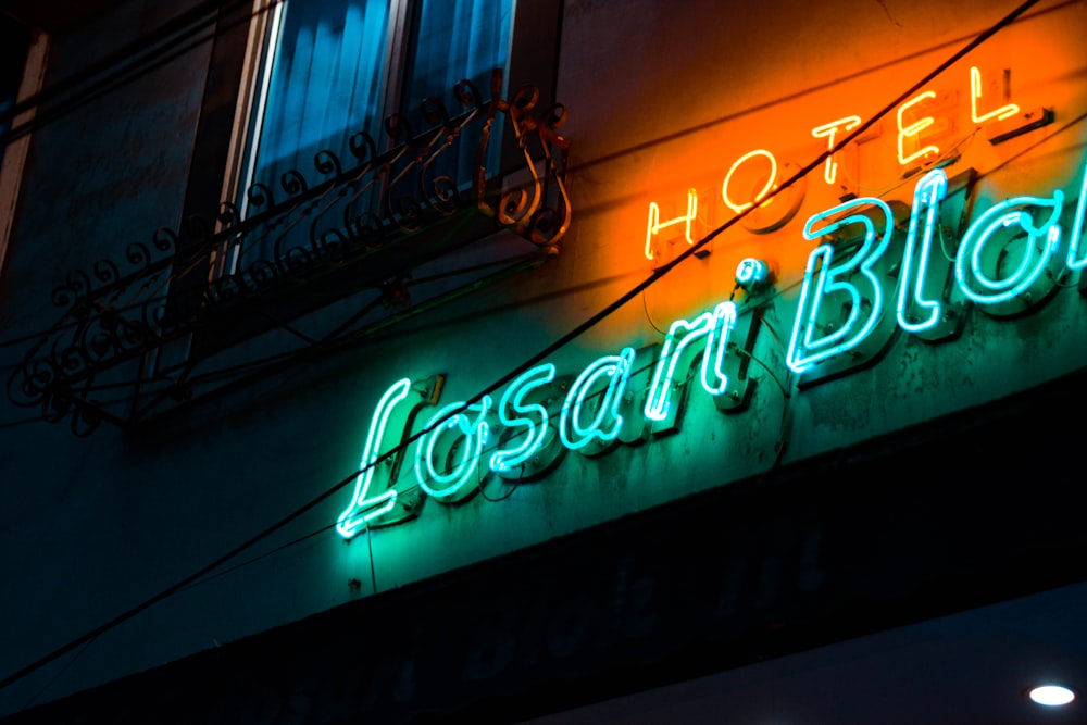 a neon sign on the side of a building