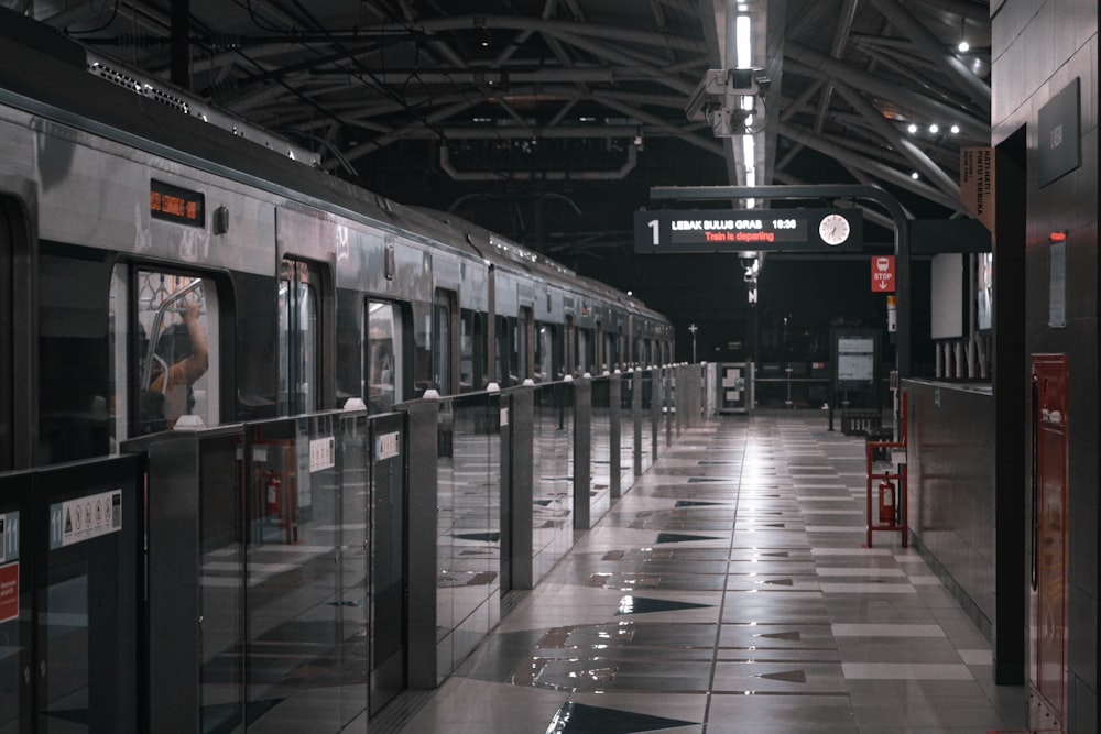 a train station with a train parked next to it