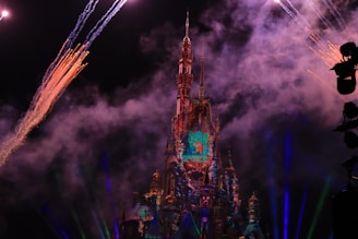 A mystical scene showing a dark castle backdrop with magical sparks in the air.