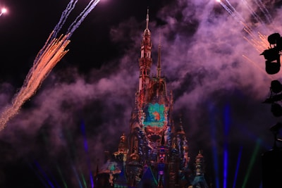 A mystical scene showing a dark castle backdrop with magical sparks in the air.