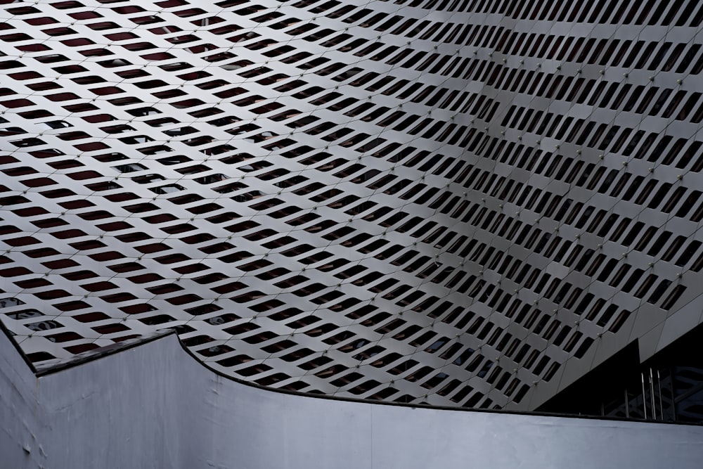 a close up of a metal structure with a skylight in the background