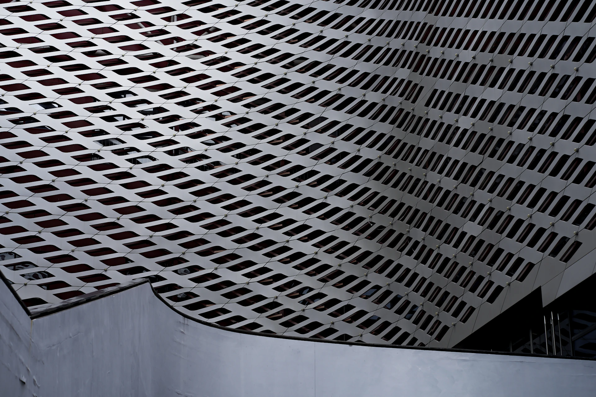a close up of a metal structure with a skylight in the background