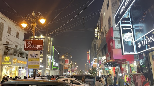 A vibrant shopping street with banners showing Indus card discounts.