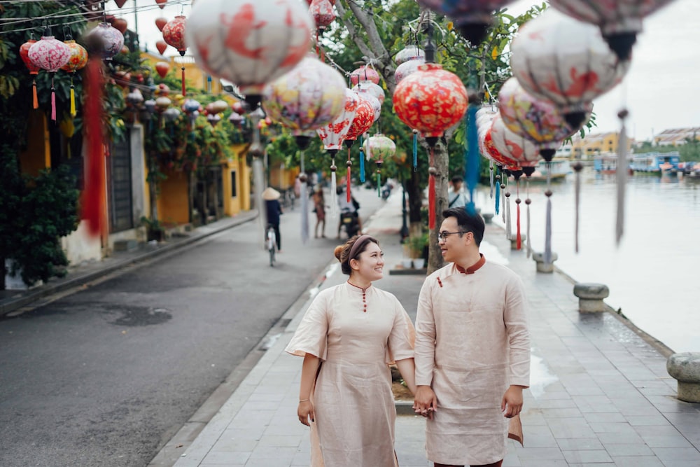 a man and a woman walking down a street