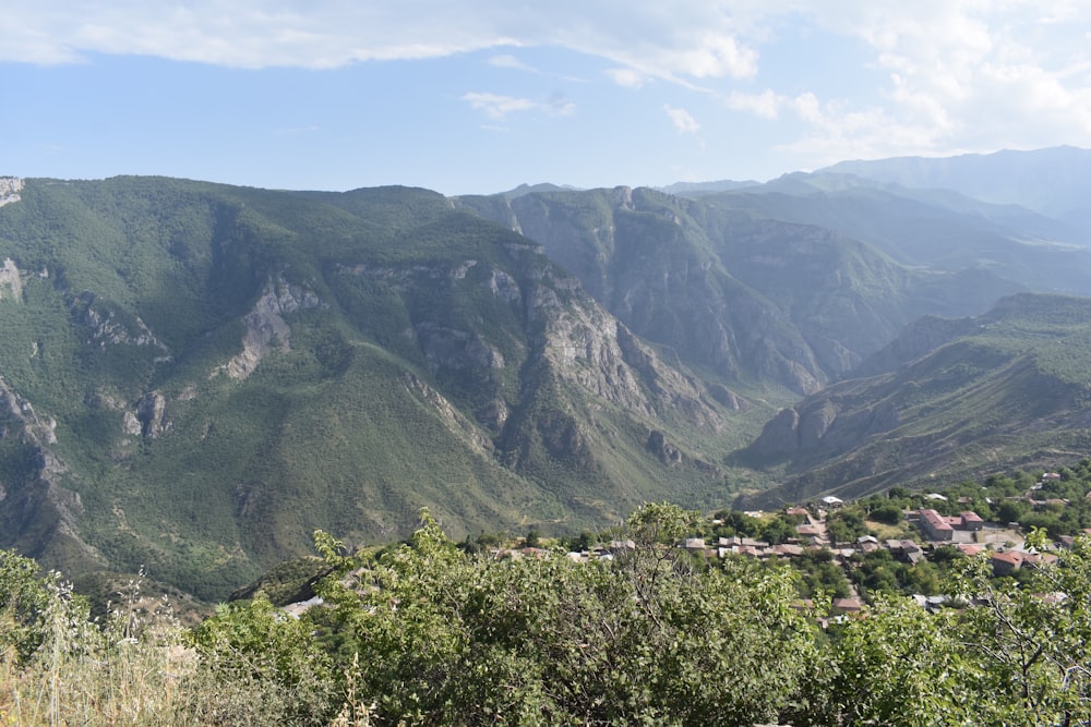 a view of a valley with mountains in the background