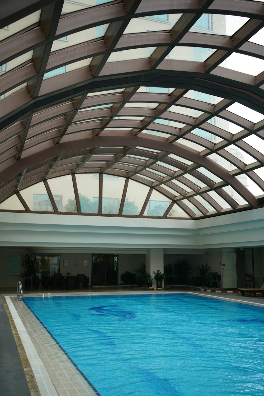 a large indoor swimming pool in a building