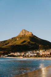 a view of a beach with a mountain in the background